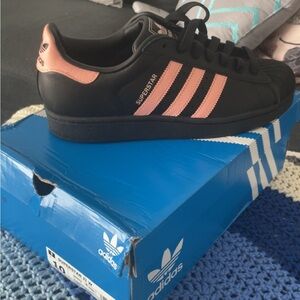 Adidas Black and Pink Sneakers with Iconic Stripes